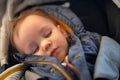 Cute little boy sleeping in stroller Royalty Free Stock Photo
