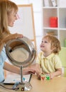 Cute little boy at speech therapist office