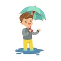 Cute little boy standing in the puddle and holding umbrella cartoon vector Illustration