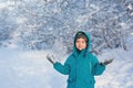 Cute little boy stands and looks towards Royalty Free Stock Photo