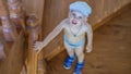 Cute little boy stands on the stairs and looks up Royalty Free Stock Photo