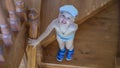 Cute little boy stands on the stairs and looks up Royalty Free Stock Photo