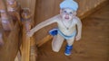 Cute little boy stands on the stairs and looks up Royalty Free Stock Photo