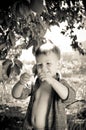 Cute little boy studying a wriggling worm Royalty Free Stock Photo