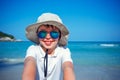 Cute little boy in sunglasses making selfie at tropical beach on exotic island Royalty Free Stock Photo