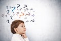 Cute little boy thinking, question marks Royalty Free Stock Photo