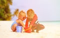 Cute little boy and toddler girl play on beach Royalty Free Stock Photo