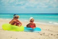 Cute little boy and toddler girl play on beach Royalty Free Stock Photo