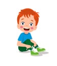Cute little boy tying his shoelaces Royalty Free Stock Photo