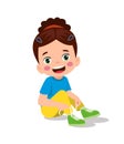 Cute little boy tying his shoelaces Royalty Free Stock Photo