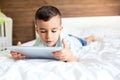 Cute little boy using his tablet Royalty Free Stock Photo