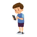 Cute little boy using mobile phone Royalty Free Stock Photo