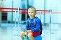 Cute little boy waiting in the airport Royalty Free Stock Photo