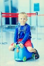 Cute little boy waiting in the airport Royalty Free Stock Photo