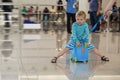 Cute little boy waiting in the airport Royalty Free Stock Photo