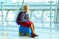 cute little boy waiting in the airport Royalty Free Stock Photo