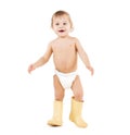 Cute little boy walking in big rubber boots Royalty Free Stock Photo