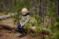 Cute little boy walks in Swiss national Park on spring. Hiking with little kids Royalty Free Stock Photo