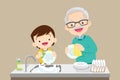 Cute boy washing dish with grandfather