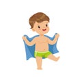 Cute little boy wiping his with a towel, kid playing at the beach, happy infants outdoor activity on summer vacations Royalty Free Stock Photo