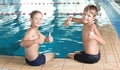 Cute little boys near indoor pool