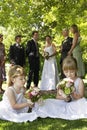 Cute Little Bridesmaids Holding Bouquets In Lawn Royalty Free Stock Photo