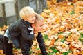 Cute little brothers on a walk in autumn day. Family, fashion, vacation and lifestyle concept. Fashionable boys in park Royalty Free Stock Photo