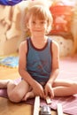 Cute little candid five year old kid boy playing at home with children`s toys cars and the wooden road on a floor of room in a co Royalty Free Stock Photo