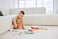 Cute little caucasian boy drawing with colorful pencils, sitting on floor. Creativity Royalty Free Stock Photo