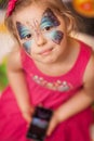 Girl with butterfly face painting Royalty Free Stock Photo