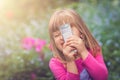 Little girl playing with her smartphone Royalty Free Stock Photo