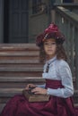 Cute little caucasian girl wearing retro clothes. Nice female child in beautiful vintage dress. Royalty Free Stock Photo