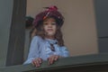 Cute little caucasian girl wearing retro clothes. Nice female child in beautiful vintage dress. Royalty Free Stock Photo