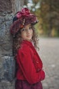 Cute little caucasian girl wearing retro clothes. Nice female child in beautiful vintage dress. Royalty Free Stock Photo