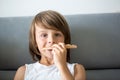 Cute little Caucasian kid eating pizza. Hungry child taking a bite from pizza on a pizza party, outdoors Royalty Free Stock Photo