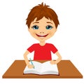 Cute little caucasian student boy writing Royalty Free Stock Photo