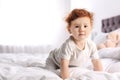Cute child on bed at home Royalty Free Stock Photo