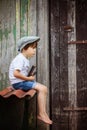 Cute little child, boy, holding big metal key and a book, willin Royalty Free Stock Photo