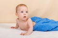 Little baby boy is relaxing and smiling happily on the bed after bath Royalty Free Stock Photo