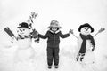 Cute little child boy on snowy field outdoor. Child boy Having Fun in Winter Park. Winter children in frosty winter Park Royalty Free Stock Photo