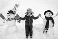 Cute little child boy on snowy field outdoor. Child boy Having Fun in Winter Park. Winter children in frosty winter Park Royalty Free Stock Photo