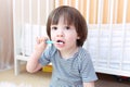 Cute little child cleans teeth