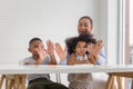 Cute little child girl and boy drawing at home, children with grandmother playing in living room Royalty Free Stock Photo