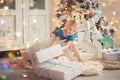 Cute little child girl in dress smiling and having fun on bed in white bedroom Royalty Free Stock Photo