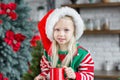 Cute little child girl eating sweet cookies and drinking hot chocolate Royalty Free Stock Photo