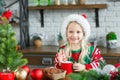 Cute little child girl eating sweet cookies and drinking hot chocolate Royalty Free Stock Photo