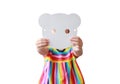 Cute little child girl showing blank white animal paper mask fronting her face isolated on white background. Idea and concept for