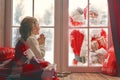 Girl by window at Christmas Royalty Free Stock Photo