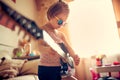 Cute little child girl in sunglasses playing guitar. Royalty Free Stock Photo