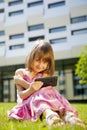 Cute little child girl using smartphone and learnig remote distance